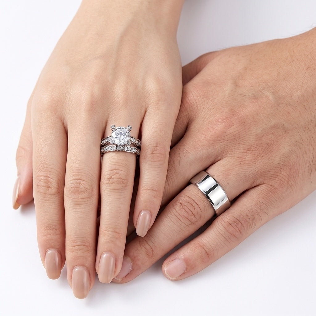 Two hands with diamond rings on a white background
